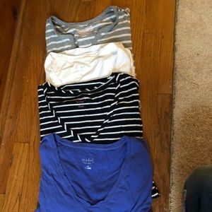 Lot of long sleeved maternity tee shirts.